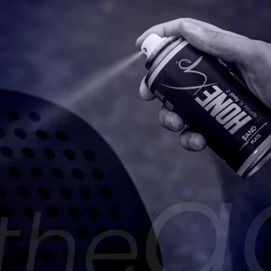 The spray being applied to a racket face